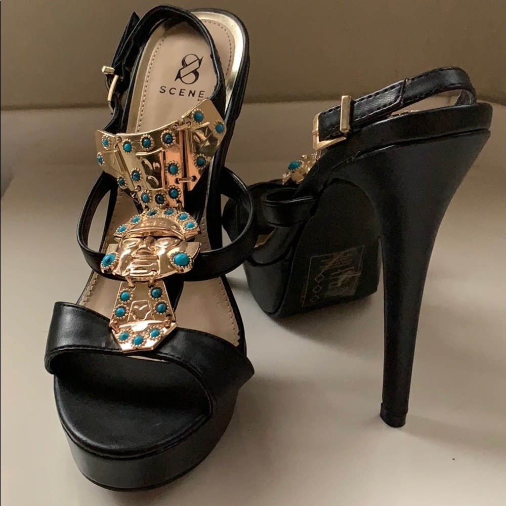 Black heels with gold embellishment